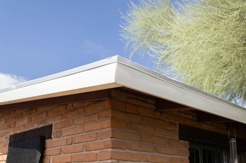 Clean aluminum fascia wrap installed over a Tucson roofline, replacing painted wood fascia