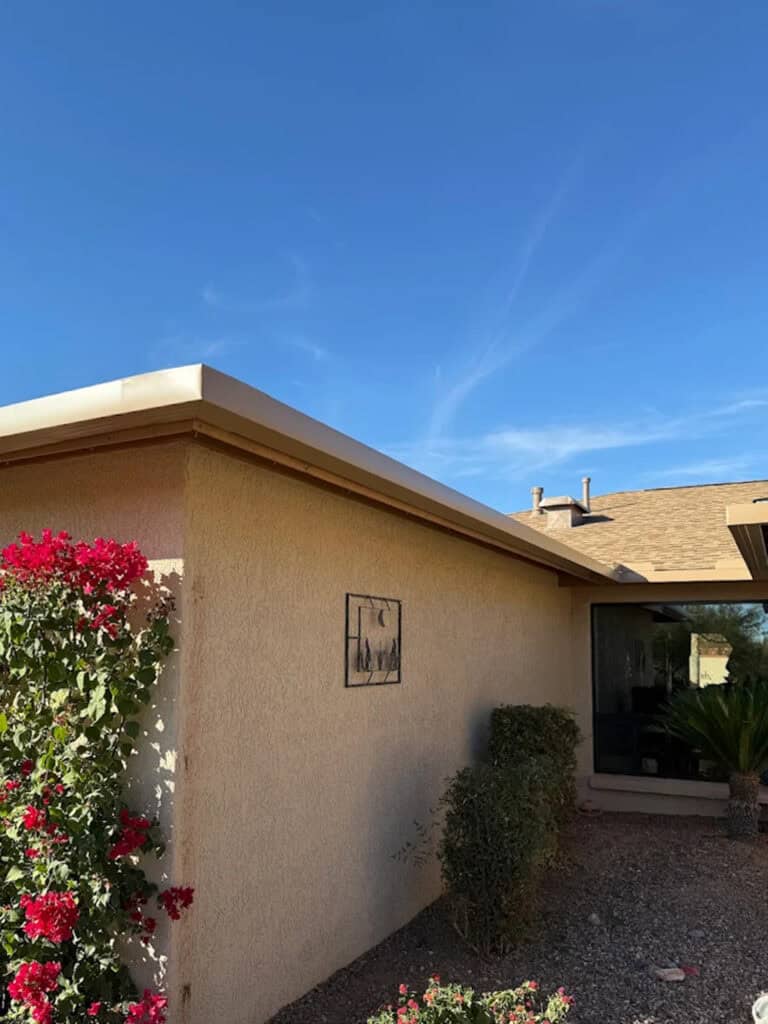 Seamless rain gutter running the length of a tan stucco home in Southern Arizona