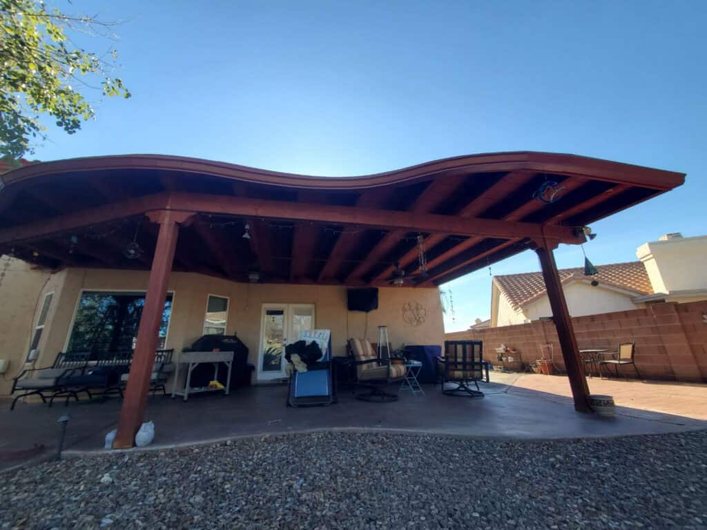 Seamless gutter following the curved roofline of a patio cover in Tucson, Arizona