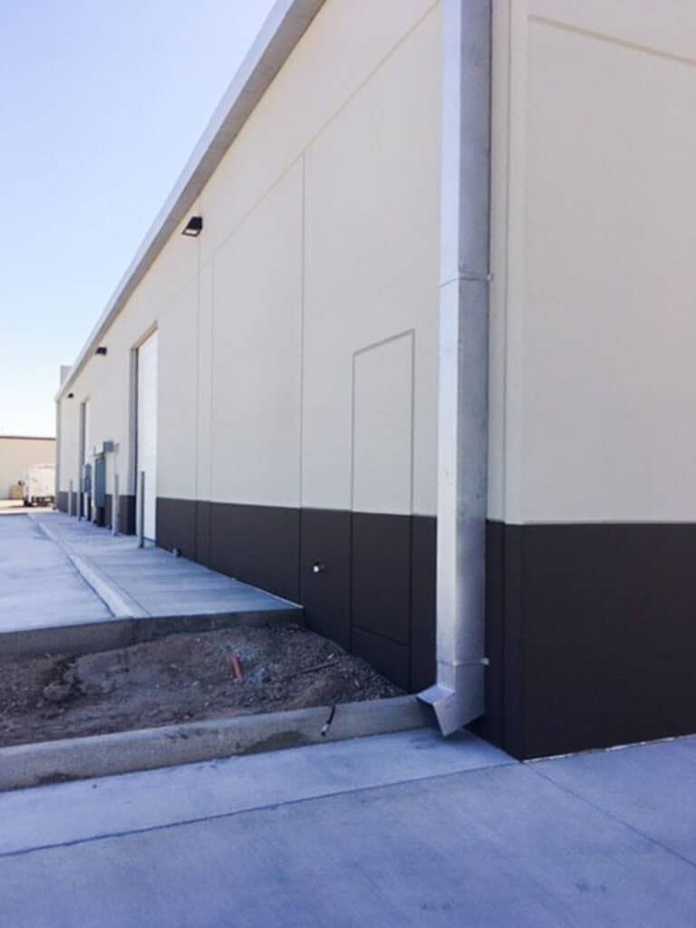 Commercial gutter downspout on a warehouse building in Southern Arizona