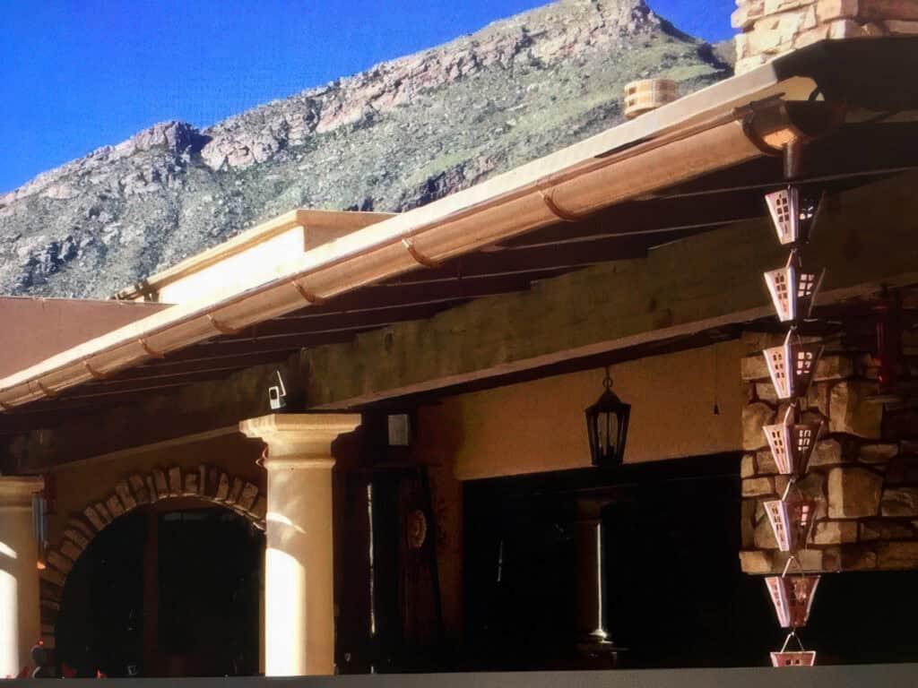 Copper gutter and copper rain chain on a home in the Tucson foothills