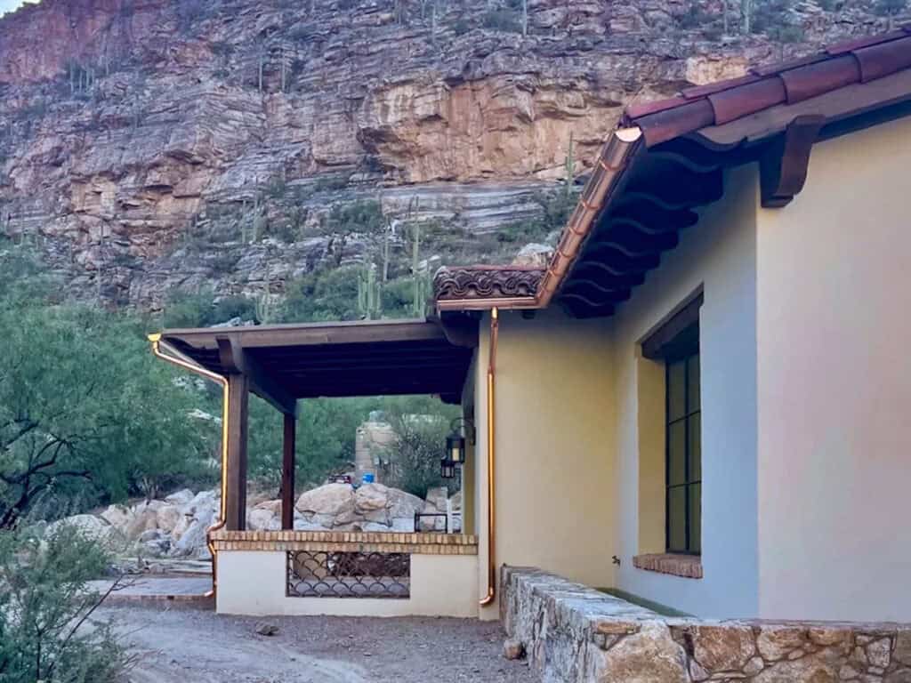 Copper gutters and downspout on a tile roof home in the Tucson foothills