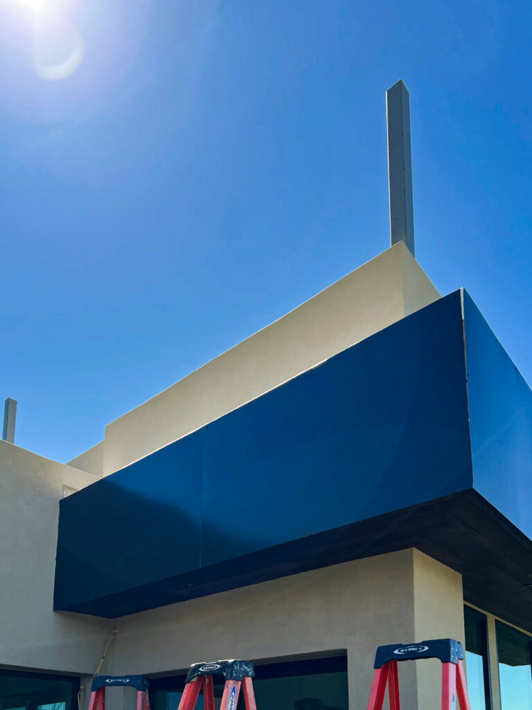 Navy blue aluminum fascia wrap installed on a home in Southern Arizona